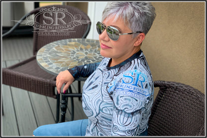 Our sexy model is wearing SUGAR &amp; SNOW ~ SR Rash Guard - SIB.BLING RIVALRYWear A Tude clothing by SibBling Rivalry Design. Our striking Sugar Skull design on a form fitting sports shirt. 