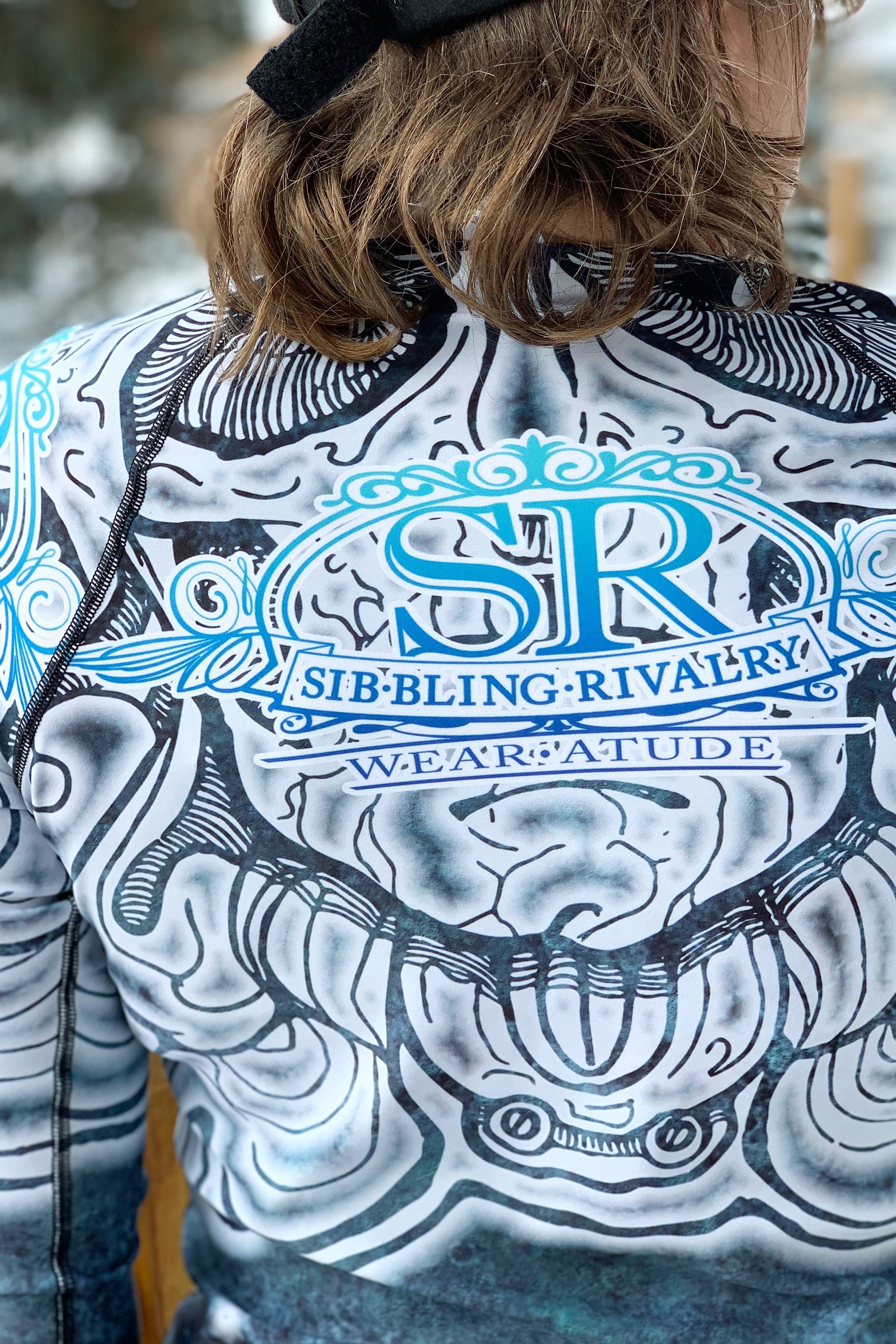 Wear A Tude clothing by SibBling Rivalry Design. Our striking Sugar Skull design on a form fitting sports shirt. Back view.SUGAR &amp; SNOW ~ SR Rash Guard - SIB.BLING RIVALRY